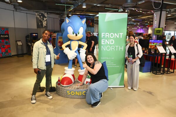 Afterparty photo of attendees with Sonic and the Front End North banner